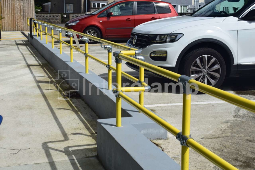Interclamp Safety Yellow modular handrails installed for pedestrian safety in carpark